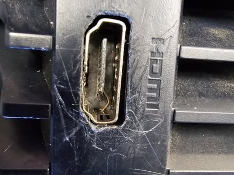 PS5 HDMI port with damaged connector, before repair