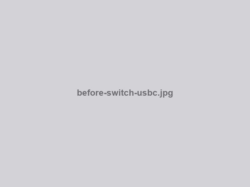 Worn Nintendo Switch USB-C charging port with bent pins before replacement